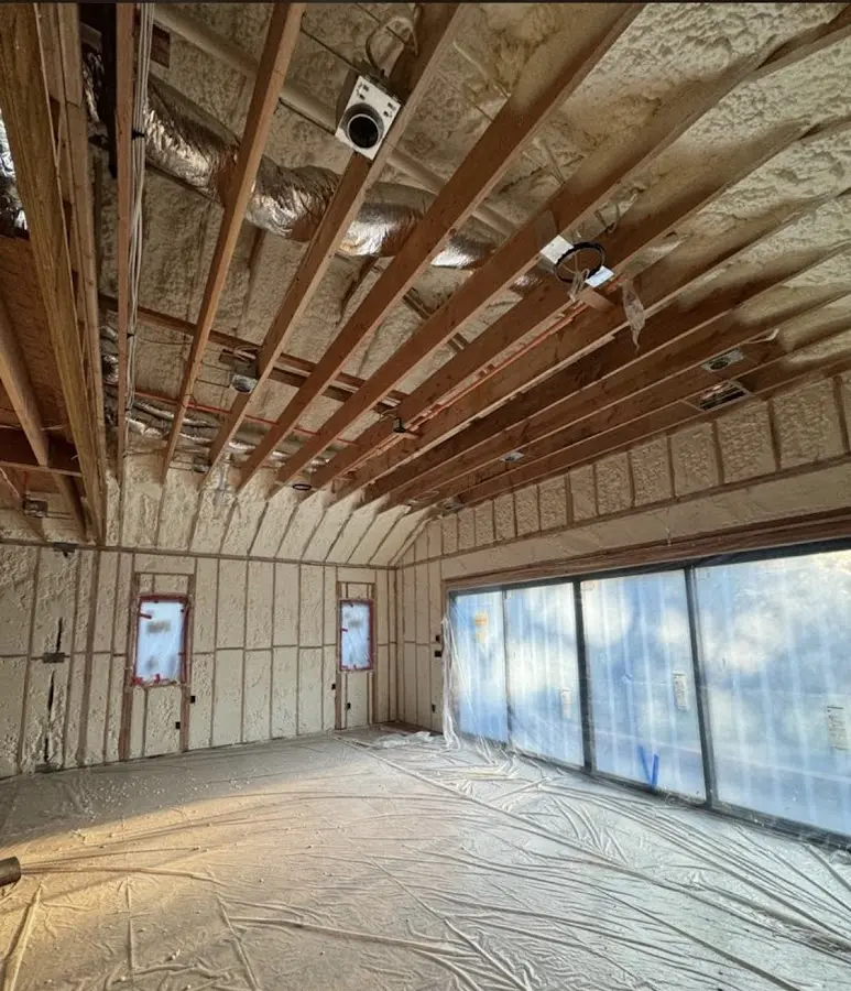 Interior walls and ceiling insulated with spray foam during new construction in Lynnfield